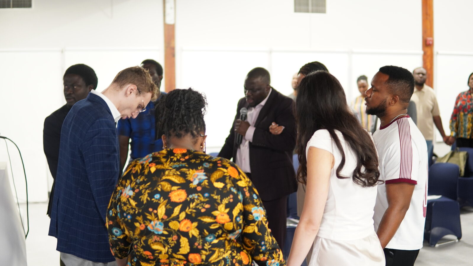 Attendees gathered in prayer at Church & State